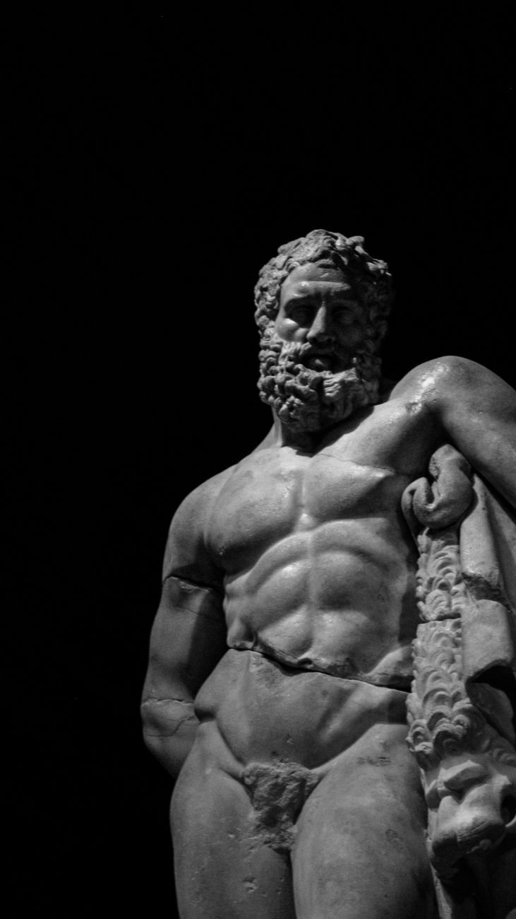 a black and white photo of a statue